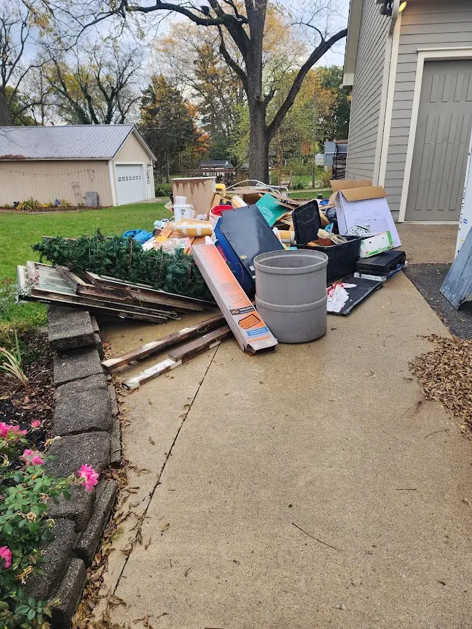 Dumpster being loaded with debris for 10 Yard Dumpster Rental in Salida